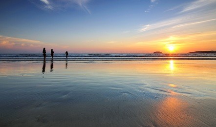 silhouettes of people in tanjung aru beach, kota kinabalu, sabah borneo, malaysia.