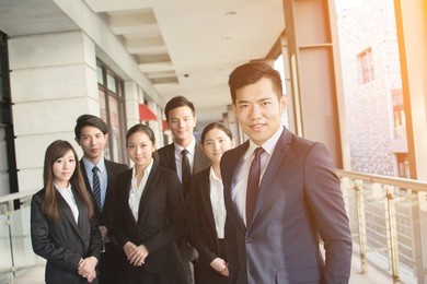 successful business team of asian in the city.