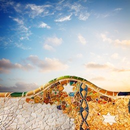 detail of famous colorful bench of park guell at sunrise, barcelona, spain