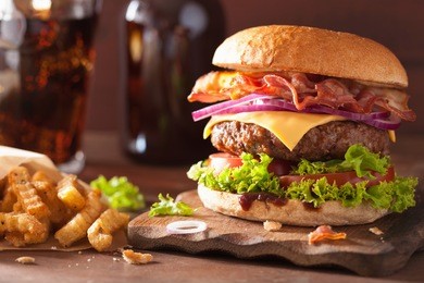 bacon cheese burger with beef patty tomato onion