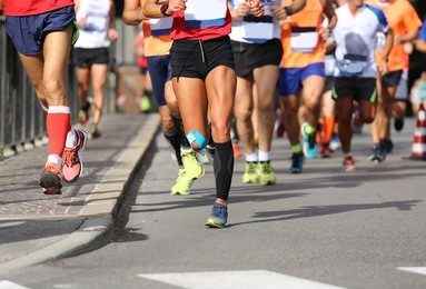 many runners during the marathon in the city street