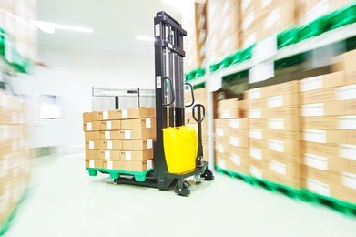 warehouse stacker loader truck at work
