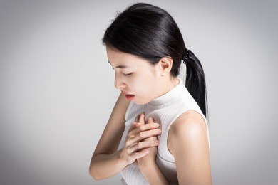 young woman heart attack or broken heart