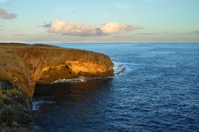 a beautiful photograph of banzai cliff at sunrise on the island of saipan.