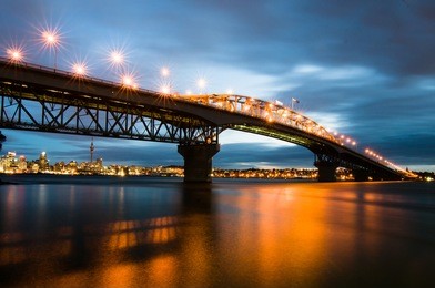 beautiful view of auckland harbor bridge during blue hour. 