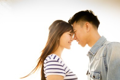 smiling couple in love with sunlight background