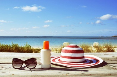 sun lotion and sunglasses