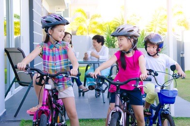 asian kids enjoying cycling