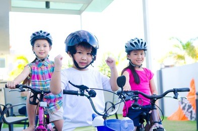 asian kids enjoying cycling