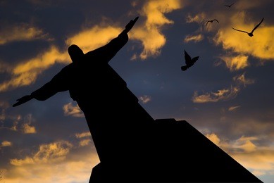 statue in rio de janeiro at sunset