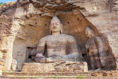 yungang grottoes. world cultural heritage. one of china's four most famous "buddhist caves art treasure houses", is located datong, shanxi province. it is cave 20. buddha is 13.7 metres high. 