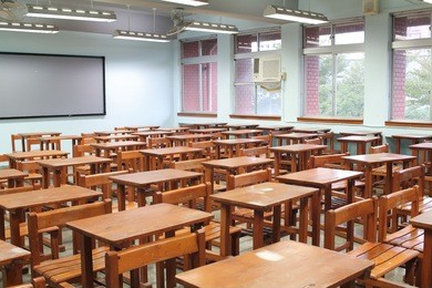 empty classroom with desks and chairs