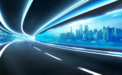 abstract blurred speed motion road in glass tunnel over the city