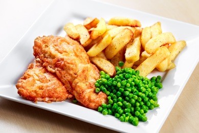 british traditional fish and chips with peas