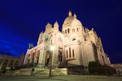beautiful view of the basilica sacre-coeur in paris, france, at night