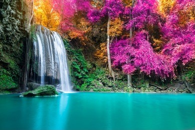 waterfall in autumn forest at erawan national park, thailand 