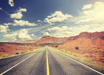 vintage toned scenic desert road, usa.