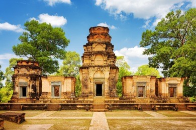 prasat kravan temple is khmer monument in ancient temple complex angkor wat, siem reap, cambodia. woods and blue sky in background. angkor wat is a popular tourist attraction.
