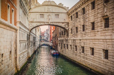 gondolas on the canal bridge of sighs (ponte dei sospiri) in venice. in fact bridge of sighs, who took last breath freedom of losing on the gallows.