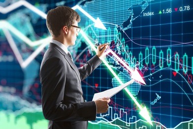 businessman presses on the screen with business chart