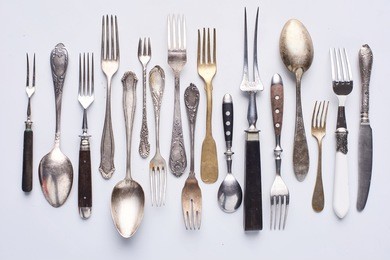 old, modern, new, vintage, silver, wooden cutlery, kitchenware, knife, fork, spoon studio shot close up.