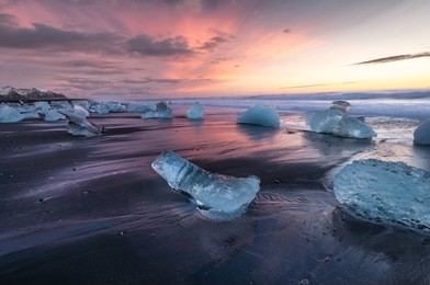 ice on the black volcanic beach near jokulsarlon glacier lagoon, winter iceland