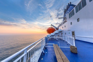 deck on ferry sailing across the northsea during beautiful sunset