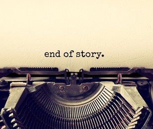 close up image of typewriter with paper sheet and the phrase: end of story. copy space for your text. retro filtered
