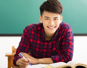 smiling  college student in university classroom