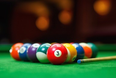 billiard balls in a green pool table, game