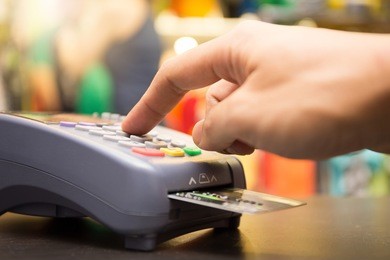 credit card payment, buy and sell products & service with clothing store in background