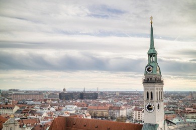 view overlooking the town of munich with a tower of the famous st. peter's church in the foreground.