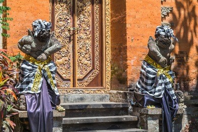 balinese hindu statues in  on the street ubud palace, gianyar, bali 