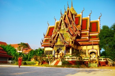 thailand landmark. scenic view of buddhist pagoda at sunset. temple complex wat phra yai ( wat plai laem ), big buddha temple at koh samui. travel, tourism. oriental architecture. landscape background