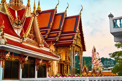 thailand landmark. scenic view of buddhist pagoda at sunset. temple complex wat phra yai ( wat plai laem ), big buddha temple at koh samui. travel, tourism. oriental architecture. landscape background