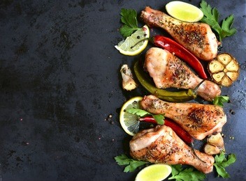 grilled spicy chicken legs.top view.copy space background.