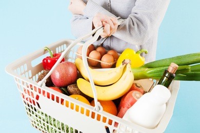 women with a supermarket basket , reduced tax rate , consumption tax