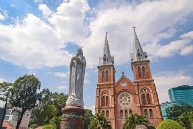 saigon notre-dame cathedral basilica (basilica of our lady of the immaculate conception) on blue sky background in ho chi minh city, vietnam. ho chi minh is a popular tourist destination of asia.