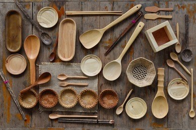 various kitchen utensils on wooden table