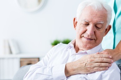 image of ill positive senior man with support