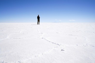 lonely traveler in salar de uyuni (bolivia)