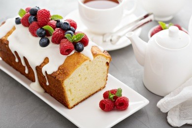 yogurt pound cake for breakfast with glaze and fresh berries