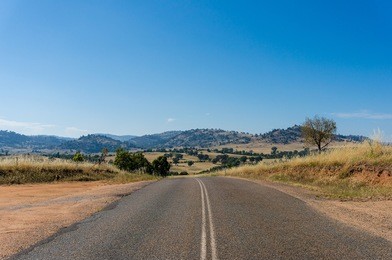 australian outback road. rural road on sunny day. young region, nsw, australia