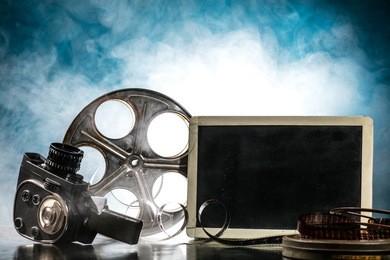 retro film production accessories still life. concept of film-making. smoke effect on background