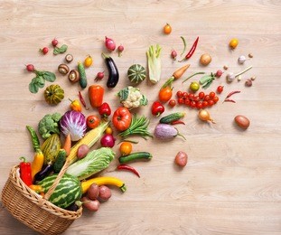 healthy food background / studio photography of different fruits and vegetables on wooden table