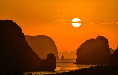 silhouette beautiful sunrise between mountain in phang nga bay thailand