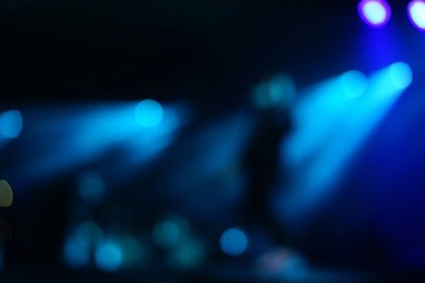 defocused entertainment concert lighting on stage, blurred disco party.