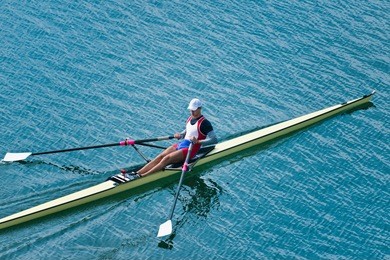 single scull rowing competitor