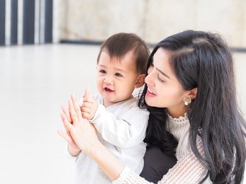 beautiful asian mother and son on indoor daylight.