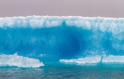 chunks of ice that calved off a tidewater glacier float around in the frigid waters of prince william sound, alaska